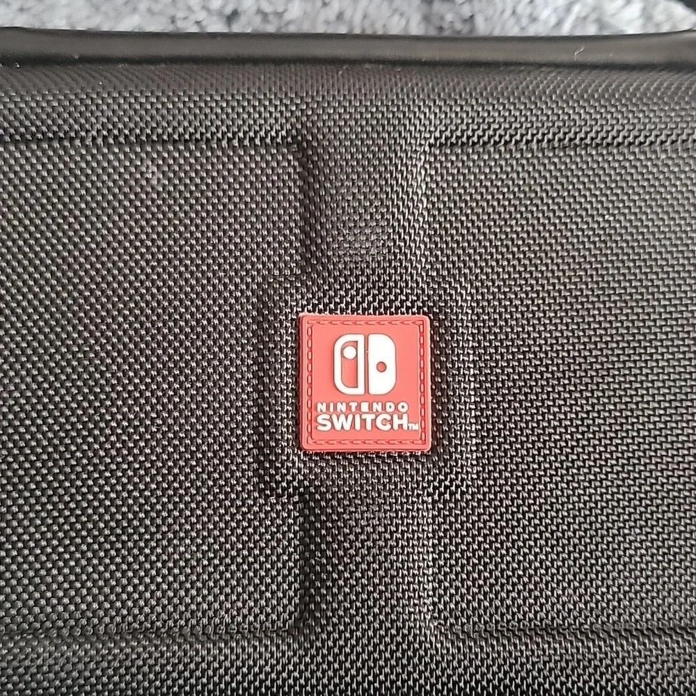 Nintendo Switch Game Traveler Deluxe Case, black, gently used.